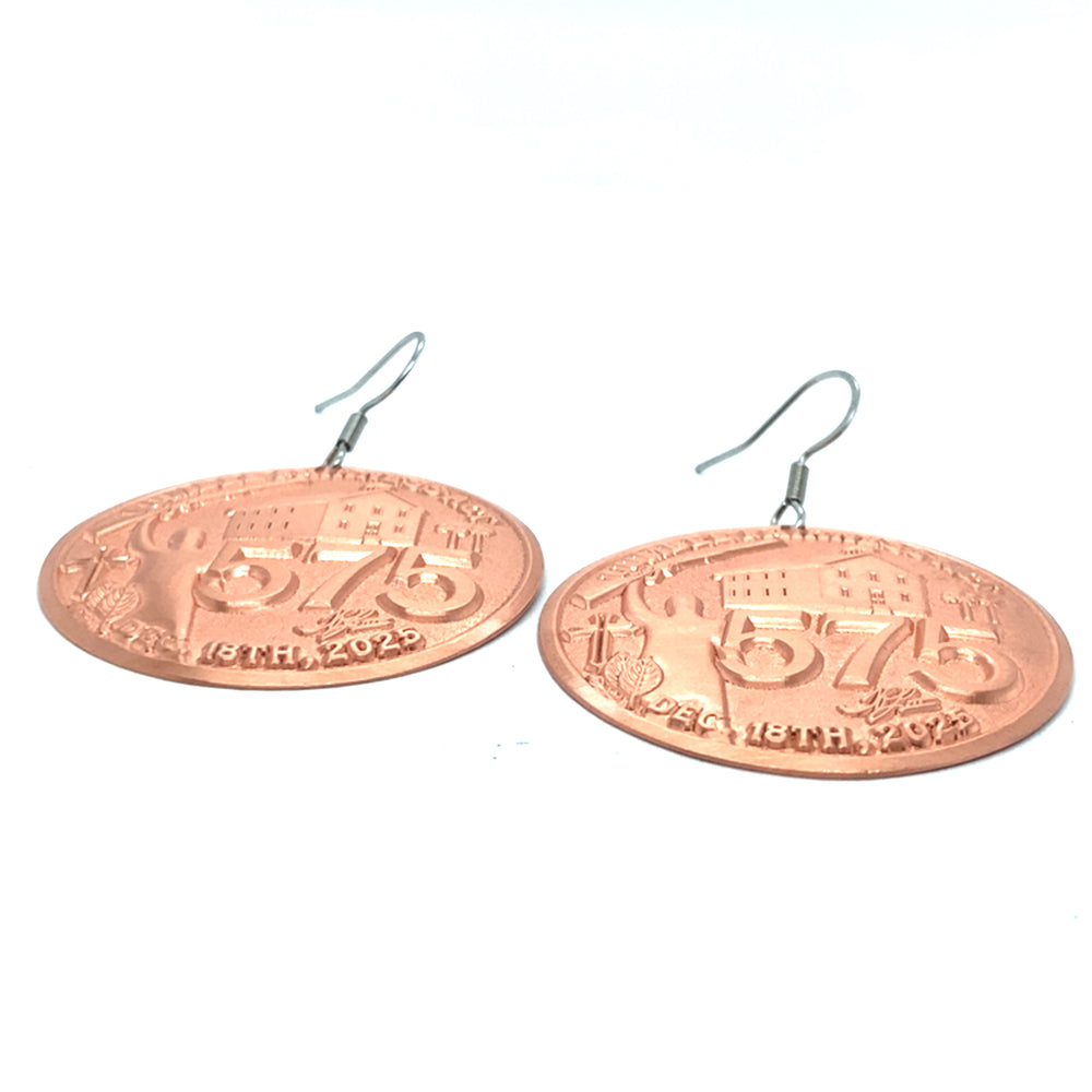 Copper Lumbee Fairness Act earrings by TPL II, featuring intricate metalwork and elegant hoop design, shown on a white background.