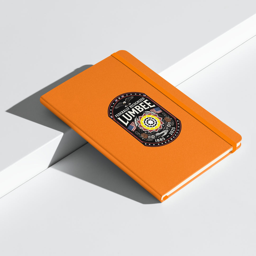 Orange hardcover Lumbee recognition notebook by Printfull, featuring embossed design and durable binding for commemorative gift.
