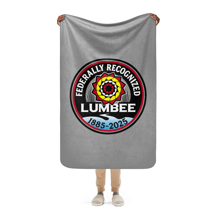 Printfull Lumbee Recognition Sherpa blanket with tan background and printed design, cozy and soft for commemorative display.