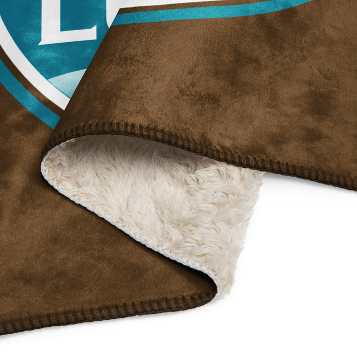 Printfull Lumbee recognition Sherpa blanket with Tan print, soft fleece material, 50x60 inches, featuring vibrant sublimated design.