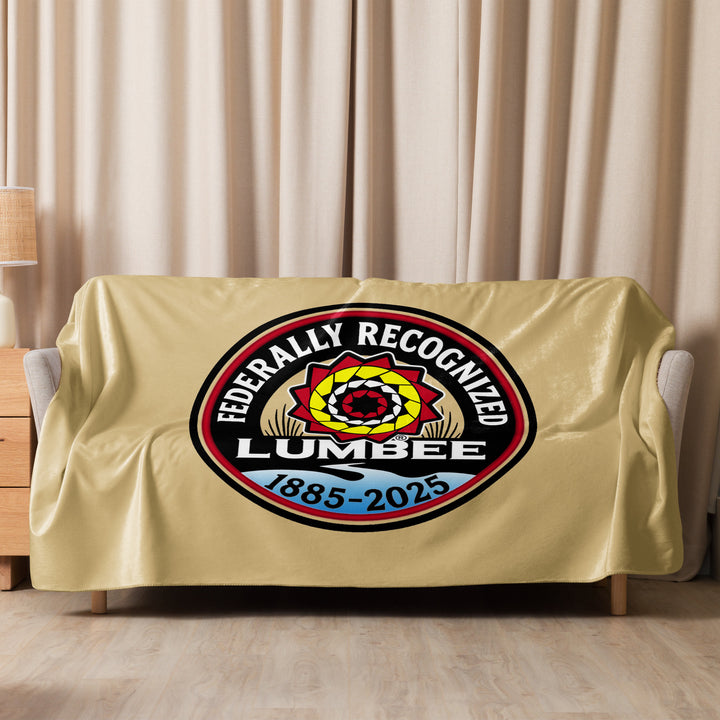 Printfull Lumbee Recognition Sherpa blanket with a printed design on tan plush fabric, 60x80 inches, featuring commemorative graphics.