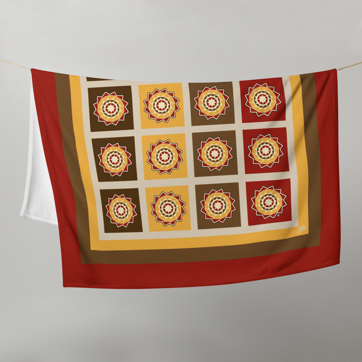 Printfull Pinecone Patchwork Throw Blanket with fall colors, featuring a cozy, patterned design in a 50x60 inch size.