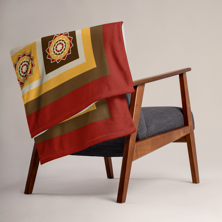 Printfull pinecone patchwork throw blanket in fall colors, showcasing a cozy design on a 50x60 inch fabric.